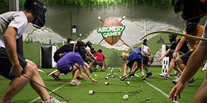 People grabbing arrows at Archery Games Calgary